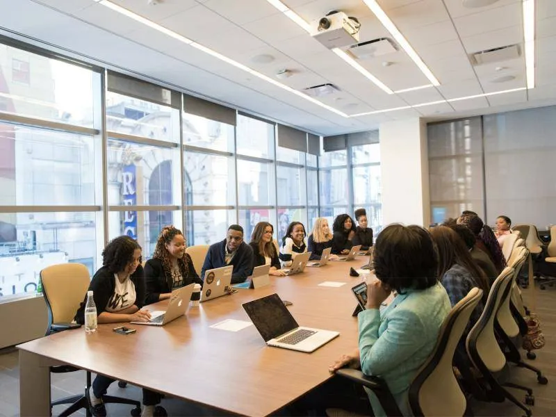 Corporate team working together around a conference table